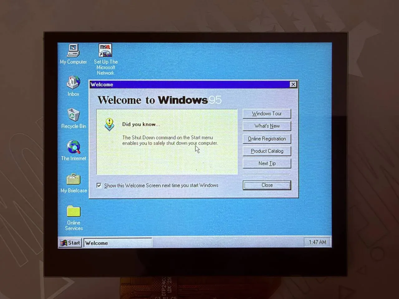 The Windows 95 desktop and Welcome dialog on the board's screen